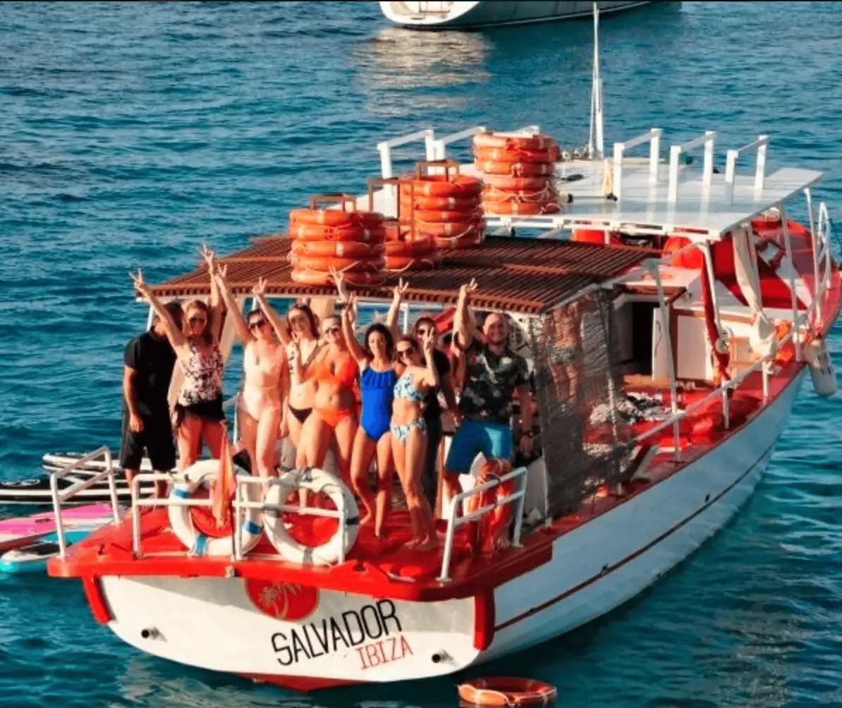 Aerial view guests relaxing on boat stern Ibiza