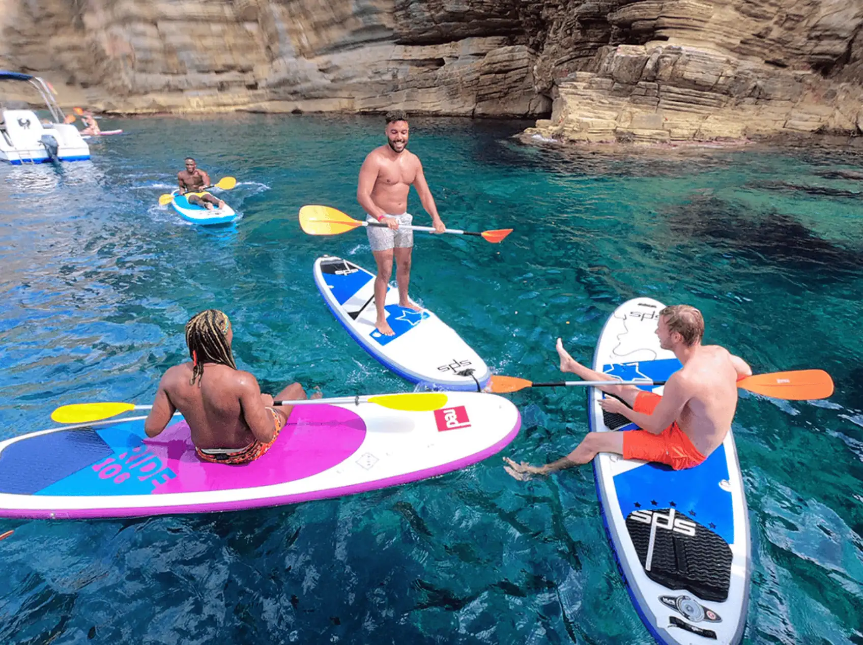 Group paddleboarding near Ibiza coast